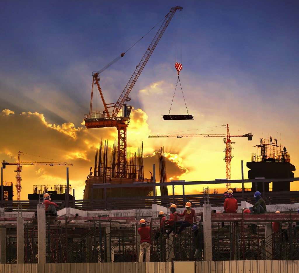 Worker Working In High Building Construction Site Against Beautiful Dusky Sky Use For Construction Business And Land ,real Estate ,civil Development