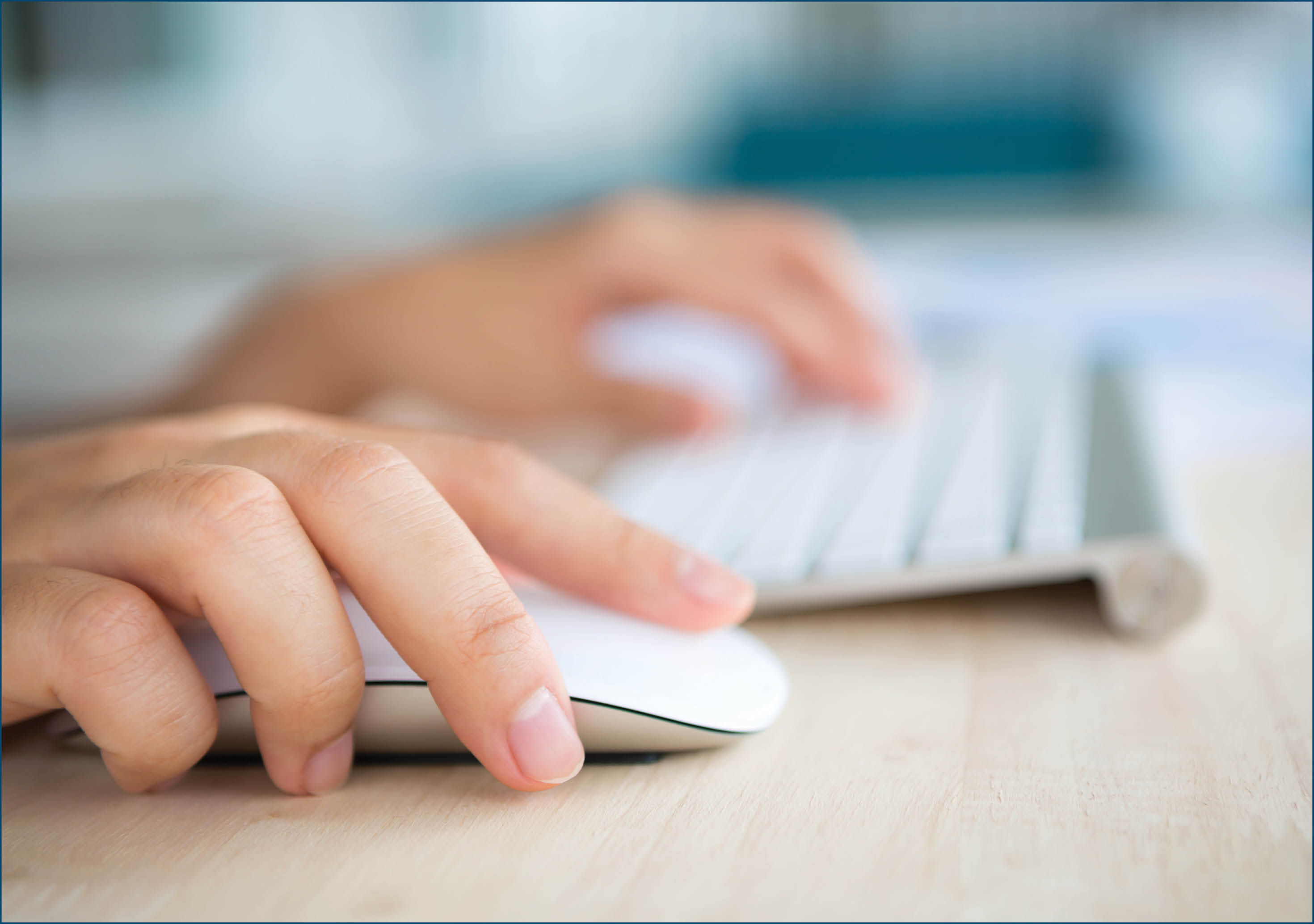 Closeup of business woman hand typing on keyboard and mouse
