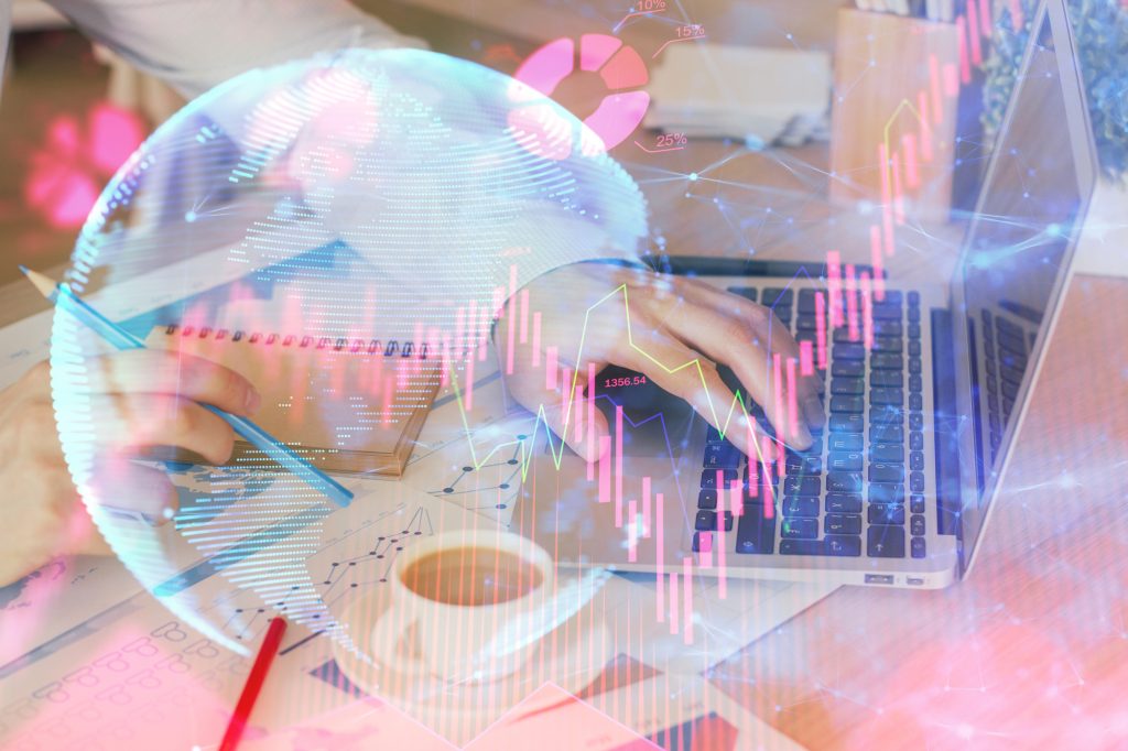 Double Exposure Of Businessman Working On Laptop On Background. International Business Hologram In Front. Concept Of Success.