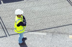 standing worker on road works; horizontal orientation